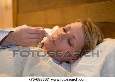 Stock Photo - taking temperature. Fotosearch