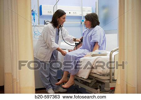 Taking the blood pressure, DSU (Day Surgery Unit). Hospital de Zumarraga, Gipuzkoa, Euskadi, Spain View Large Photo Image Stock Image - Taking the blood pressure, DSU (Day Surgery Unit). Hospital de Zumarraga, Gipuzkoa, Euskadi, Spain. Fotosearch