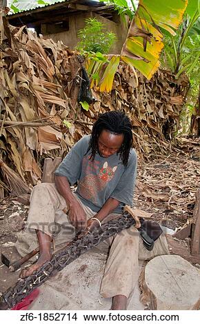 Tanzania Africa Mosquito Village Mto Wa Mbu town village with artists carving ebony wood souvenir art 5 View Large Photo Image Picture - Tanzania Africa Mosquito Village Mto Wa Mbu town village with artists carving ebony wood souvenir art 5. Fotosearch