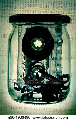 Stock Image - Tape in a glass jar. Fotosearch