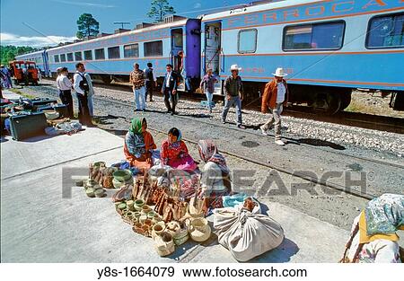 Tarahumura Indians in front of Chihuahua al Pacifico Train = CHEPE, Divisadero, Barranca del Cobre View Large Photo Image Stock Photo - Tarahumura Indians in front of Chihuahua al Pacifico Train = CHEPE, Divisadero, Barranca del Cobre. Fotosearch