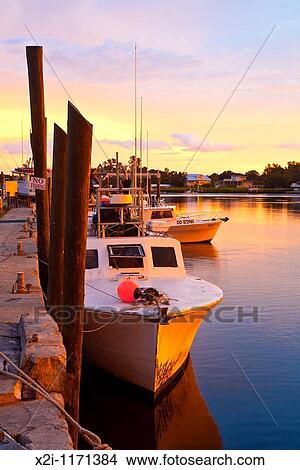 Tarpon Springs, FL - Jul 2010 - Fishing boat along dock at Tarpon Springs, Florida View Large Photo Image Picture - Tarpon Springs, FL - Jul 2010 - Fishing boat along dock at Tarpon Springs, Florida. Fotosearch