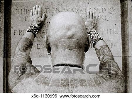 Tattooed man displays his tattoos View Large Photo Image Stock Photograph - Tattooed man displays his tattoos. Fotosearch