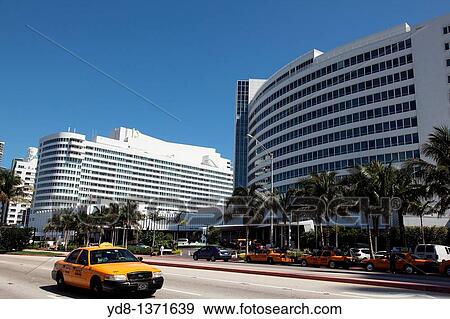 Stock Photo - Taxi and Hotel Fontanblue Collins Avenue in Miami Beach, Florida, USA. Fotosearch