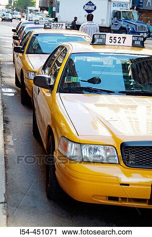 Stock Image - Taxi cabs provide transportation for travelers to Chicago, Illinois. USA.. Fotosearch