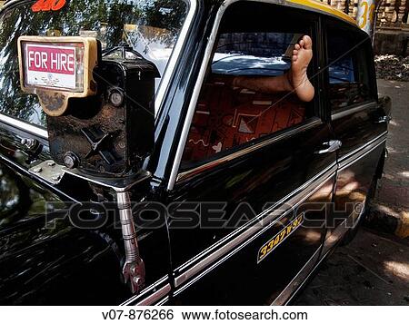 Taxi driver resting, Mumbai, Maharashtra, India View Large Photo Image Stock Photograph - Taxi driver resting, Mumbai, Maharashtra, India. Fotosearch