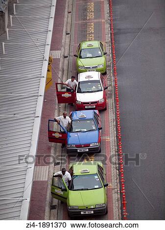 Taxi drivers pushing their car at a pick up zone in Kuala Lumpur Malaysia View Large Photo Image Stock Image - Taxi drivers pushing their car at a pick up zone in Kuala Lumpur Malaysia. Fotosearch