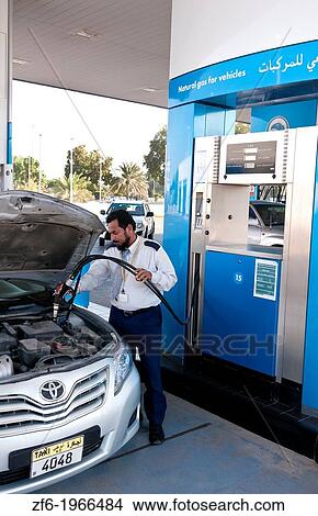 Taxi getting modern Natural Gas in auto at station for green world in Dubai in UAE United Arab Emirates. View Large Photo Image Picture - Taxi getting modern Natural Gas in auto at station for green world in Dubai in UAE United Arab Emirates.. Fotosearch
