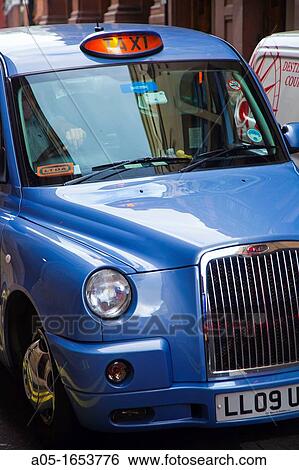 Taxi in Piccadilly Circus Soho London England United Kingdom UK Europe. View Large Photo Image Stock Photograph - Taxi in Piccadilly Circus Soho London England United Kingdom UK Europe.. Fotosearch