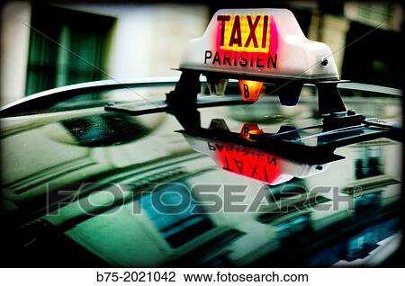 Taxi Parisien sign, on a street in Paris, France View Large Photo Image Stock Image - Taxi Parisien sign, on a street in Paris, France. Fotosearch