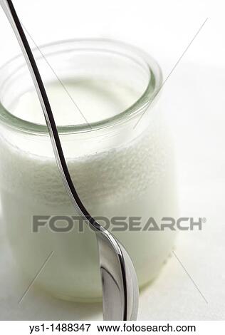 Tea Spoon with Glass of Natural Yoghurt against White Background View Large Photo Image Stock Photo - Tea Spoon with Glass of Natural Yoghurt against White Background. Fotosearch