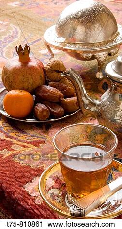 Tea, tangerine, pomegranate and nuts View Large Photo Image Stock Image - Tea, tangerine, pomegranate and nuts. Fotosearch