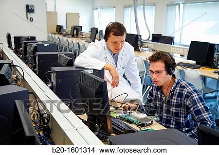 Teacher and student, Laboratory digital signal processing, Computer room, Telecommunications, Electronics and Communications Unit, CEIT (Center of Studies and Technical Research), University of Navarra, Donostia, Gipuzkoa, Basque Country, Spain View Large Photo Image Picture - Teacher and student, Laboratory digital signal processing, Computer room, Telecommunications, Electronics and Communications Unit, CEIT (Center of Studies and Technical Research), University of Navarra, Donostia, Gipuzkoa, Basque Country, Spain. Fotosearch