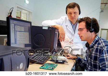 Teacher and student, Laboratory digital signal processing, Computer room, Telecommunications, Electronics and Communications Unit, CEIT (Center of Studies and Technical Research), University of Navarra, Donostia, Gipuzkoa, Basque Country, Spain View Large Photo Image Stock Photo - Teacher and student, Laboratory digital signal processing, Computer room, Telecommunications, Electronics and Communications Unit, CEIT (Center of Studies and Technical Research), University of Navarra, Donostia, Gipuzkoa, Basque Country, Spain. Fotosearch
