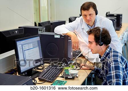 Teacher and student, Laboratory digital signal processing, Computer room, Telecommunications, Electronics and Communications Unit, CEIT (Center of Studies and Technical Research), University of Navarra, Donostia, Gipuzkoa, Basque Country, Spain View Large Photo Image Stock Photograph - Teacher and student, Laboratory digital signal processing, Computer room, Telecommunications, Electronics and Communications Unit, CEIT (Center of Studies and Technical Research), University of Navarra, Donostia, Gipuzkoa, Basque Country, Spain. Fotosearch
