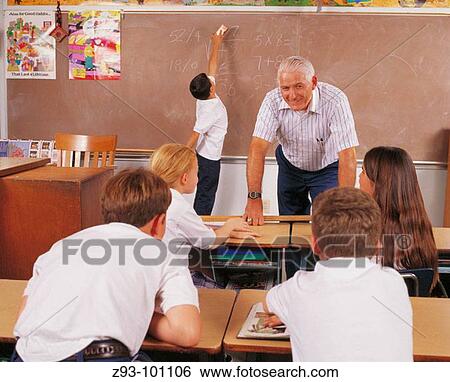 Teacher and students at school View Large Photo Image Stock Photograph - Teacher and students at school. Fotosearch