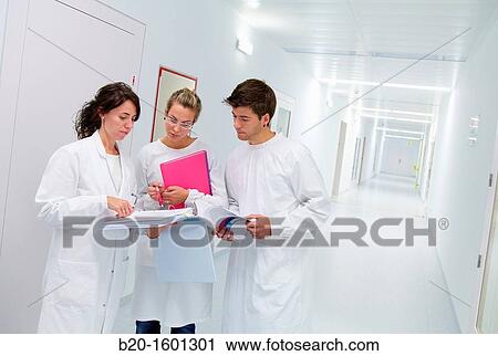 Teacher and students in hallway BioMEMS laboratory Research of surface chemistry and biological interactions for BioMEMS bio functionalization View Large Photo Image Stock Image - Teacher and students in hallway BioMEMS laboratory Research of surface chemistry and biological interactions for BioMEMS bio functionalization. Fotosearch
