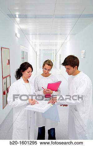 Teacher and students in hallway BioMEMS laboratory Research of surface chemistry and biological interactions for BioMEMS bio functionalization View Large Photo Image Stock Photography - Teacher and students in hallway BioMEMS laboratory Research of surface chemistry and biological interactions for BioMEMS bio functionalization. Fotosearch