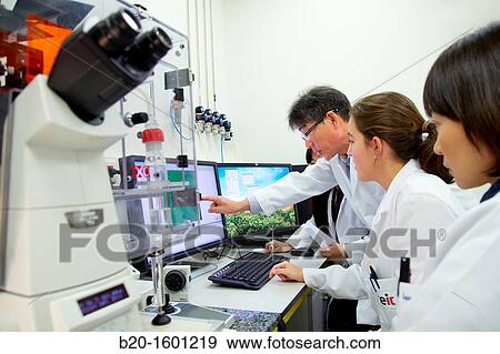 Teacher and students. Inverted optical microscope. View Large Photo Image Stock Photo - Teacher and students. Inverted optical microscope.. Fotosearch