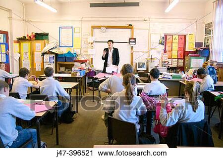 Teacher teaching a classroom of 12-13 year old children in a comprehensive school, Sheffield View Large Photo Image Stock Image - Teacher teaching a classroom of 12-13 year old children in a comprehensive school, Sheffield. Fotosearch