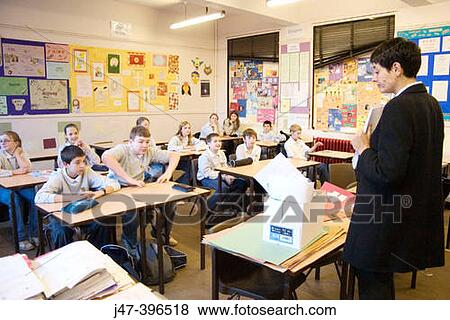 Teacher teaching a classroom of 12-13 year old children in a comprehensive school, Sheffield View Large Photo Image Stock Photo - Teacher teaching a classroom of 12-13 year old children in a comprehensive school, Sheffield. Fotosearch
