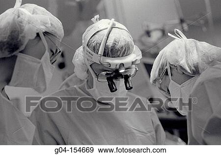 Team of doctors working View Large Photo Image Stock Photo - Team of doctors working. Fotosearch