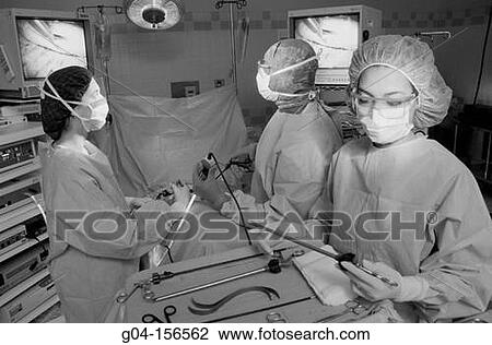 Team of surgeons during operation View Large Photo Image Stock Image - Team of surgeons during operation. Fotosearch