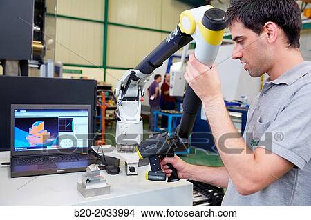 Technical inspecting production piece. MCAx measuring arm. Coordinate measuring machine portable with escanner for contactless measurement. Innovative Metrology applied. Sariki Metrology. Elgoibar. Gipuzkoa. Basque Country. Spain. View Large Photo Image Picture - Technical inspecting production piece. MCAx measuring arm. Coordinate measuring machine portable with escanner for contactless measurement. Innovative Metrology applied. Sariki Metrology. Elgoibar. Gipuzkoa. Basque Country. Spain.. Fotosearch