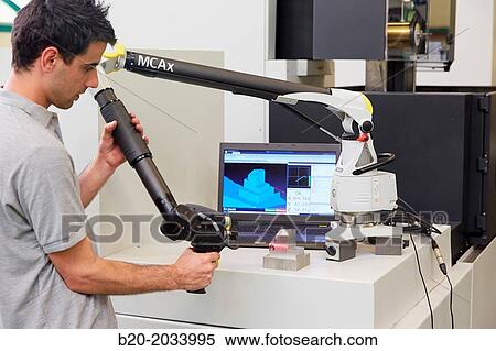 Technical inspecting production piece. MCAx measuring arm. Coordinate measuring machine portable with escanner for contactless measurement. Innovative Metrology applied. Sariki Metrology. Elgoibar. Gipuzkoa. Basque Country. Spain. View Large Photo Image Stock Photography - Technical inspecting production piece. MCAx measuring arm. Coordinate measuring machine portable with escanner for contactless measurement. Innovative Metrology applied. Sariki Metrology. Elgoibar. Gipuzkoa. Basque Country. Spain.. Fotosearch