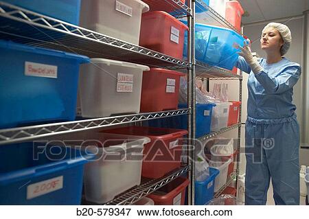 Stock Photo - Technical staff in storage area. Clean room. Laboratory, Fundaci? n Inbiomed, Genetrix Group. Center for research in stem cells and regenerative medicine. Donostia, San Sebastian, Euskadi. Spain.. Fotosearch