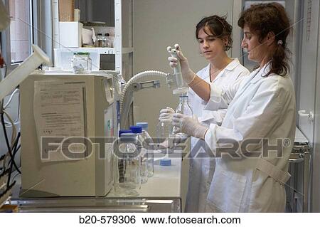 Stock Photograph - Technical staff working with the water purification equipment. Laboratory, Fundaci? n Inbiomed, Genetrix Group. Center for research in stem cells and regenerative medicine. Donostia, San Sebastian, Euskadi. Spain.. Fotosearch