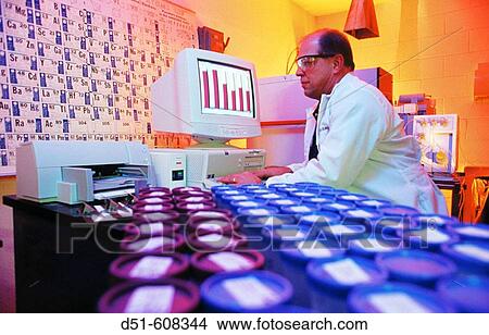 Technician checking ore samples at mine laboratory View Large Photo Image Picture - Technician checking ore samples at mine laboratory. Fotosearch