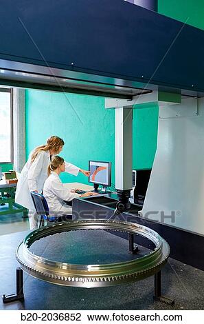 Stock Image - Technicians inspecting aircraft component. Measurement of a piece in CMM. Coordinate Measuring Machine. Innovative Metrology applied. Sariki Metrology. Elgoibar. Gipuzkoa. Basque Country. Spain.. Fotosearch