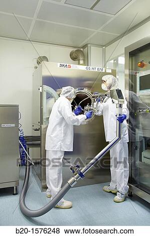 Technicians preparing a tablet coating process, Clean room, Pharmaceutical plant, Drug manufacturing plant, Research Center, Pharmacy, Area Health, Tecnalia Research & Innovation, Araba Technology Park, Miano, Basque Country, Spain View Large Photo Image Stock Photo - Technicians preparing a tablet coating process, Clean room, Pharmaceutical plant, Drug manufacturing plant, Research Center, Pharmacy, Area Health, Tecnalia Research & Innovation, Araba Technology Park, Miano, Basque Country, Spain. Fotosearch
