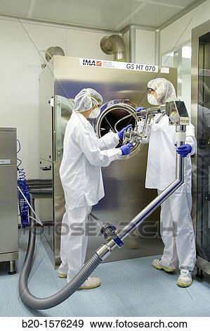 Technicians preparing a tablet coating process, Clean room, Pharmaceutical plant, Drug manufacturing plant, Research Center, Pharmacy, Area Health, Tecnalia Research & Innovation, Araba Technology Park, Miano, Basque Country, Spain View Large Photo Image Stock Photo - Technicians preparing a tablet coating process, Clean room, Pharmaceutical plant, Drug manufacturing plant, Research Center, Pharmacy, Area Health, Tecnalia Research & Innovation, Araba Technology Park, Miano, Basque Country, Spain. Fotosearch