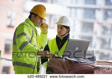 Technicians with reflective clothes and safety equipment. Housing construction, apartments. San Sebastian, Gipuzkoa, Euskadi. Spain. View Large Photo Image Stock Image - Technicians with reflective clothes and safety equipment. Housing construction, apartments. San Sebastian, Gipuzkoa, Euskadi. Spain.. Fotosearch