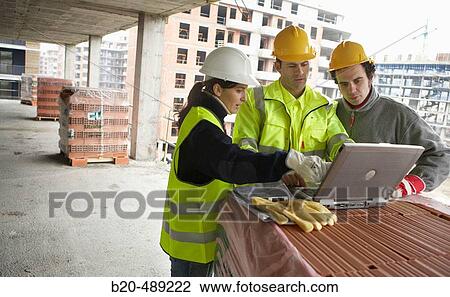 Technicians with reflective clothes and safety equipment. Housing construction, apartments. San Sebastian, Gipuzkoa, Euskadi. Spain. View Large Photo Image Stock Image - Technicians with reflective clothes and safety equipment. Housing construction, apartments. San Sebastian, Gipuzkoa, Euskadi. Spain.. Fotosearch
