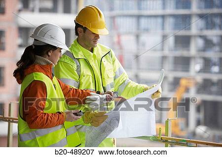 Technicians with reflective clothes and safety equipment. Housing construction, apartments. San Sebastian, Gipuzkoa, Euskadi. Spain. View Large Photo Image Stock Photo - Technicians with reflective clothes and safety equipment. Housing construction, apartments. San Sebastian, Gipuzkoa, Euskadi. Spain.. Fotosearch