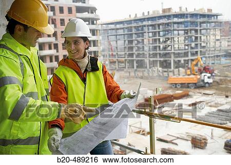Technicians with reflective clothes and safety equipment. Housing construction, apartments. San Sebastian, Gipuzkoa, Euskadi. Spain. View Large Photo Image Stock Photograph - Technicians with reflective clothes and safety equipment. Housing construction, apartments. San Sebastian, Gipuzkoa, Euskadi. Spain.. Fotosearch