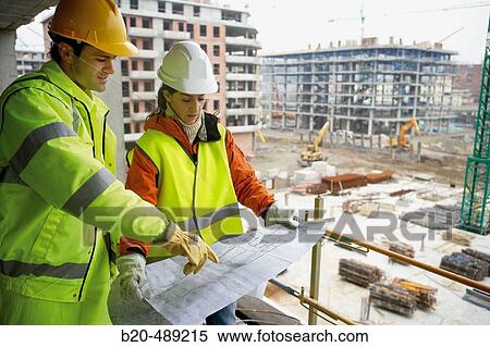 Technicians with reflective clothes and safety equipment. Housing construction, apartments. San Sebastian, Gipuzkoa, Euskadi. Spain. View Large Photo Image Stock Photography - Technicians with reflective clothes and safety equipment. Housing construction, apartments. San Sebastian, Gipuzkoa, Euskadi. Spain.. Fotosearch