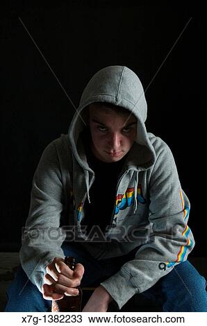 Stock Image - Teen boy smoking and drinking. Fotosearch