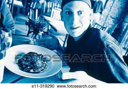Teen boy with chicken dish View Large Photo Image Stock Image - Teen boy with chicken dish. Fotosearch