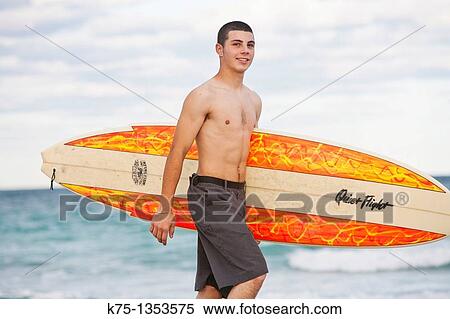 teen boy with surfboard View Large Photo Image Stock Photography - teen boy with surfboard. Fotosearch
