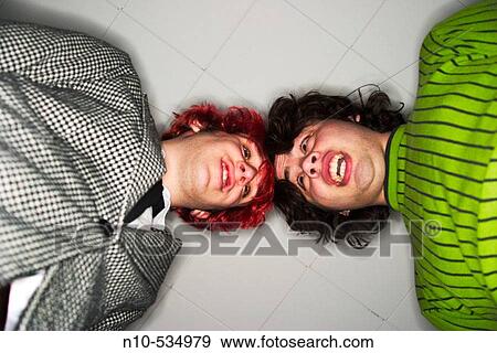 Teen boys looking down into the camera View Large Photo Image Stock Photo - Teen boys looking down into the camera. Fotosearch