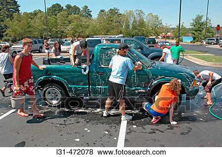 Teen church group has a donation car wash to help victims of Katrina Hurricane in Los Angeles Gulf Coast of USA View Large Photo Image Stock Photo - Teen church group has a donation car wash to help victims of Katrina Hurricane in Los Angeles Gulf Coast of USA. Fotosearch
