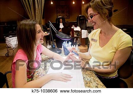 teen getting manicure View Large Photo Image Stock Photograph - teen getting manicure. Fotosearch