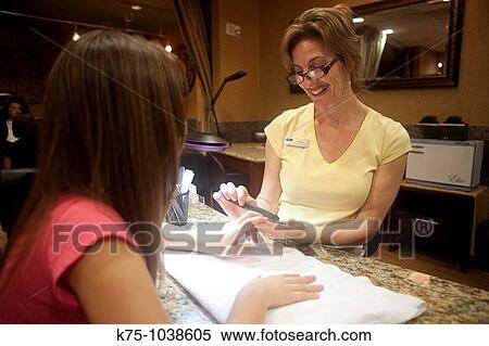 teen getting manicure View Large Photo Image Stock Photography - teen getting manicure. Fotosearch