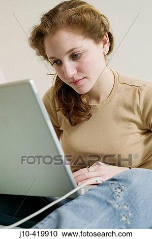 Teen girl age 17 in bedroom, laptop computer View Large Photo Image Stock Image - Teen girl age 17 in bedroom, laptop computer. Fotosearch