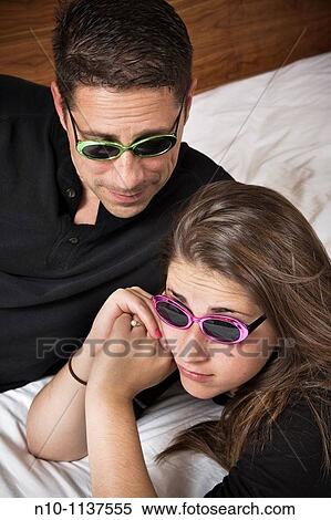 Teen girl and her father, both wearing sunglasses View Large Photo Image Stock Photography - Teen girl and her father, both wearing sunglasses. Fotosearch