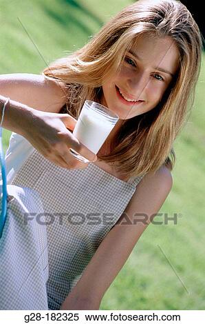 Teen girl drinking milk View Large Photo Image Stock Photography - Teen girl drinking milk. Fotosearch